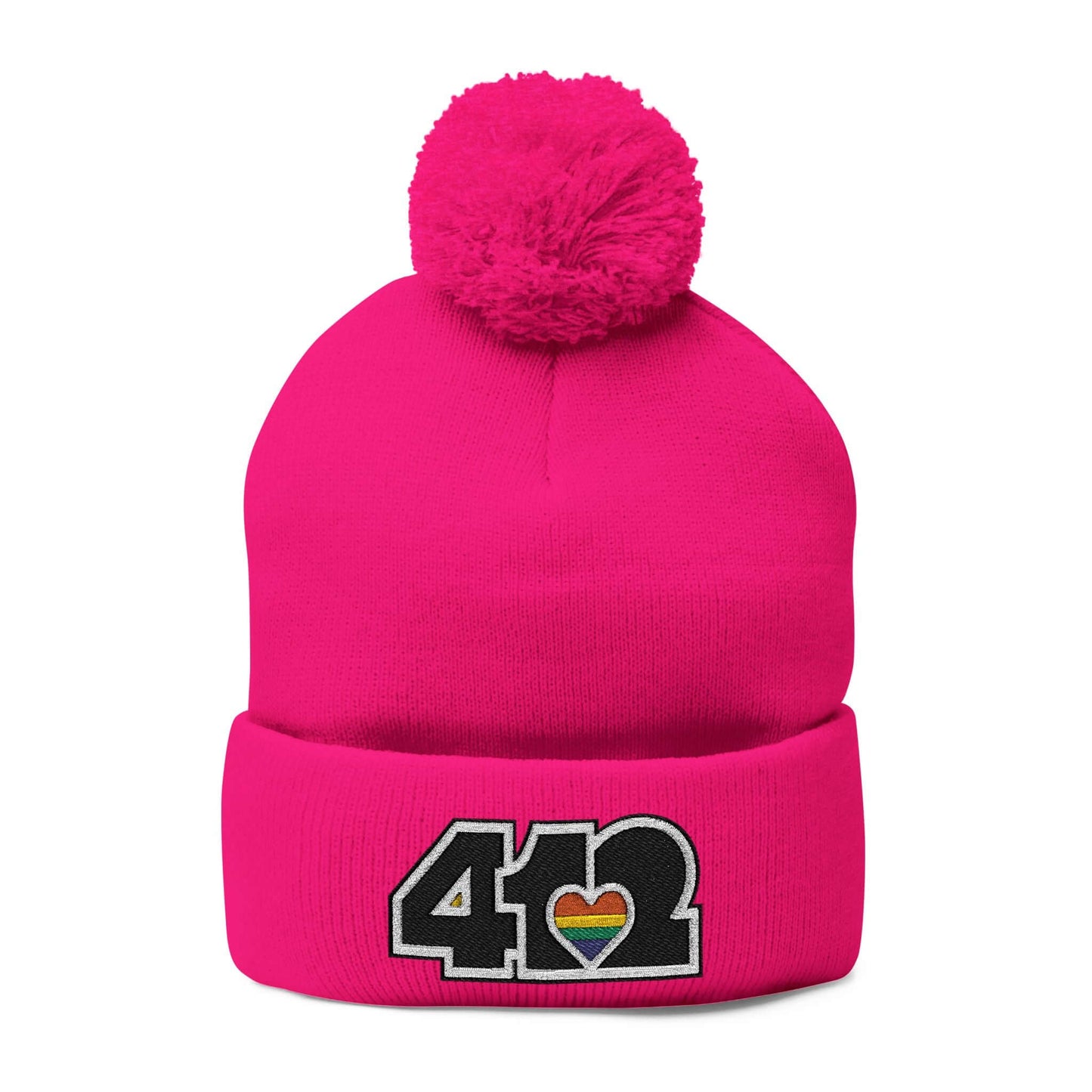 Cozy 412 Tossle Cap | Embroidered Black and Rainbow Logo. Apparel Color: Neon Pink. Has soft acrylic knit, fold-over cuff, and one-size fit for winter comfort.