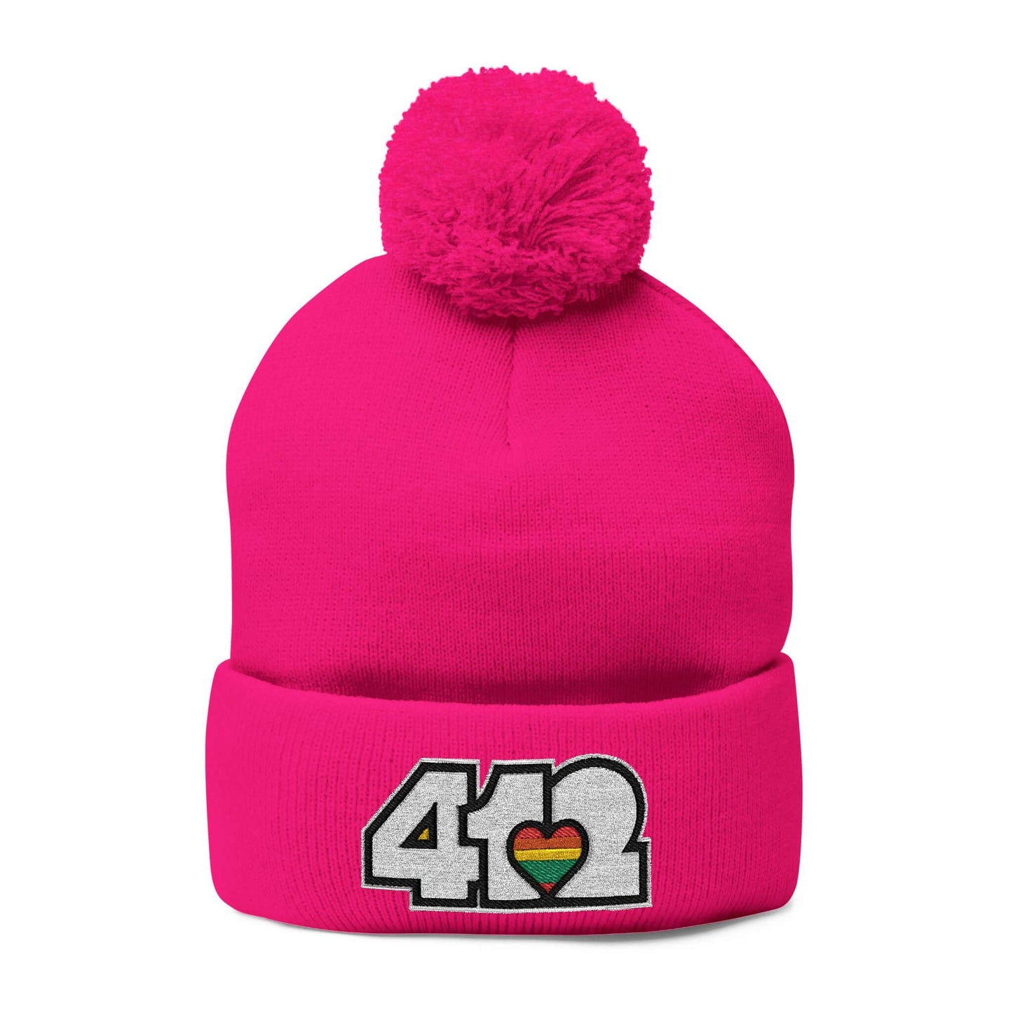 Cozy 412 Tossle Cap | Embroidered White and Rainbow Logo. Apparel Color: Neon Pink. Has soft acrylic knit, fold-over cuff, and one-size fit for winter comfort.
