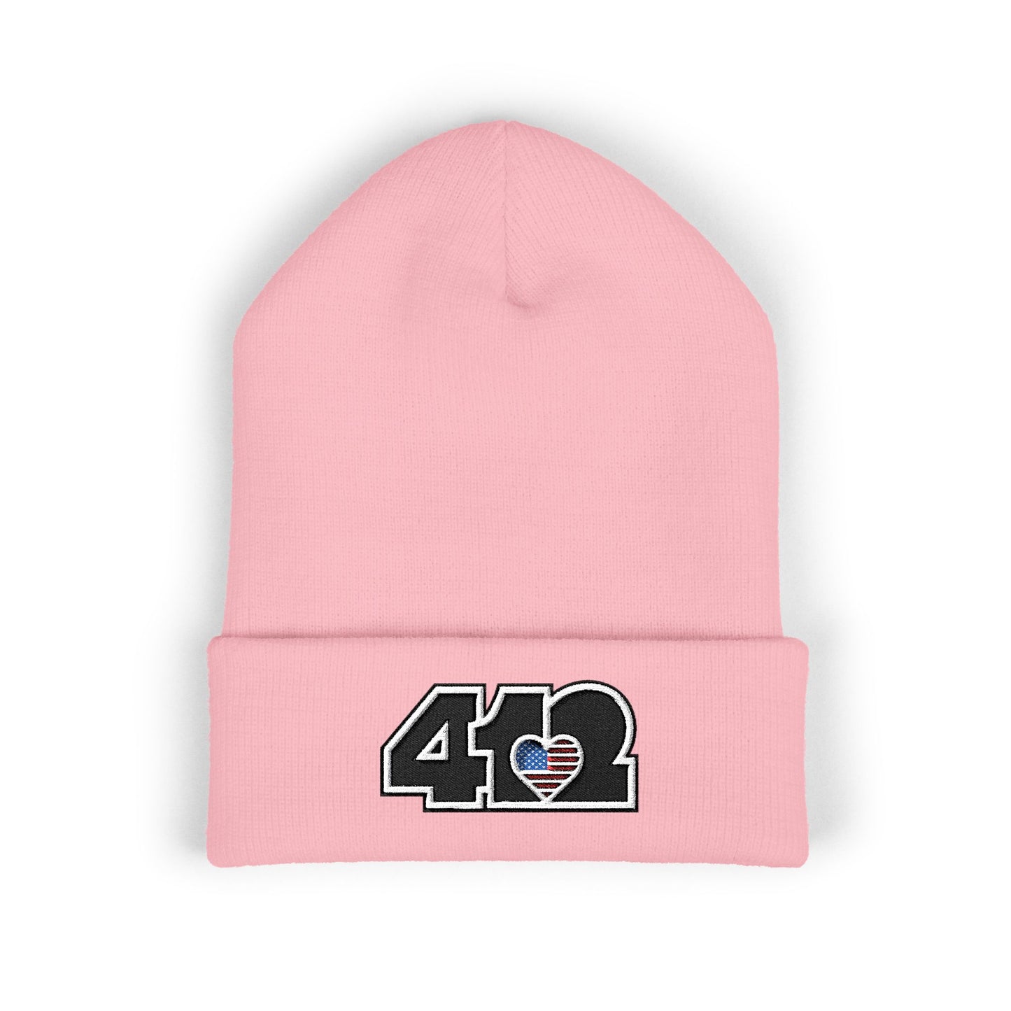 Pink 412 Skull Crown beanie with Stars & Stripes embroidered heart and black logo, channeling Pittsburgh streetwear with regal edge and radiant contrast.
