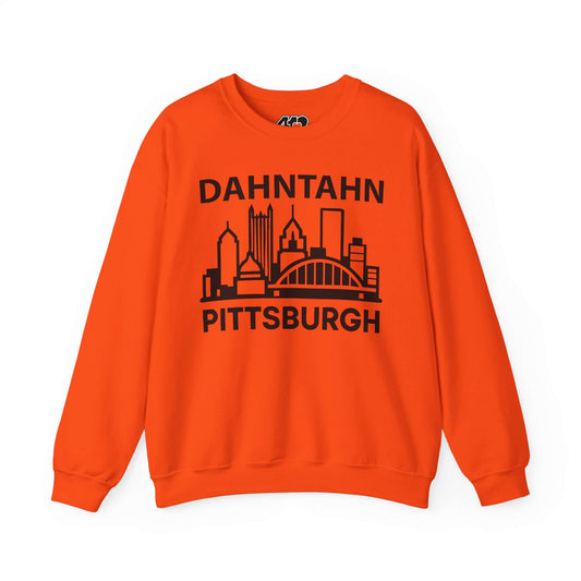 Dahntahn Pittsburgh Sweatshirt | Black Logo. Apparel Color: Orange. A blend of 50% cotton and 50% polyester for cozy durability. With an Elastic ribbed collar, and Double-needle stitching.
