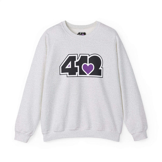 Pittsburgh Crewneck Sweatshirt | Black and Purple 412 Logo. Apparel Color: Ash. A blend of 50% cotton and 50% polyester for cozy durability. With an Elastic ribbed collar, and Double-needle stitching.