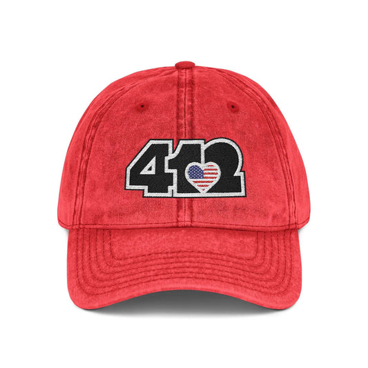 Pittsburgh Vintage Hat | Embroidered Black Stars and Stripes 412 Logo. Apparel Color: Red. A relaxed fit, cotton twill fabric, adjustable buckle, and washed-out finish look.