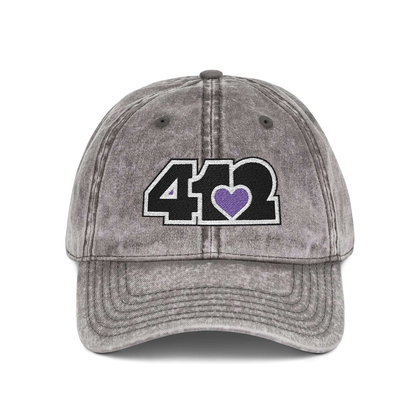 Pittsburgh Vintage Hat | Embroidered Black and Purple 412 Logo. Apparel Color: Charcoal Grey. A relaxed fit, cotton twill fabric, adjustable buckle, and washed-out finish look.