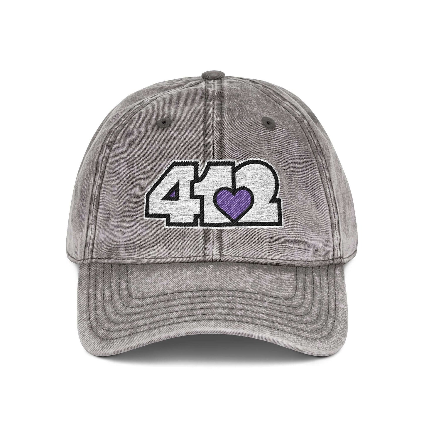Pittsburgh Vintage Hat | Embroidered White and Purple 412 Logo. Apparel Color: Charcoal Grey. A relaxed fit, cotton twill fabric, adjustable buckle, and washed-out finish look.