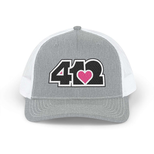 Snapback Hat | Embroidered Black and Pink 412 Logo. Apparel Color: Heather Grey/White. A comfy mid-profile adjustable fit for everyday flair