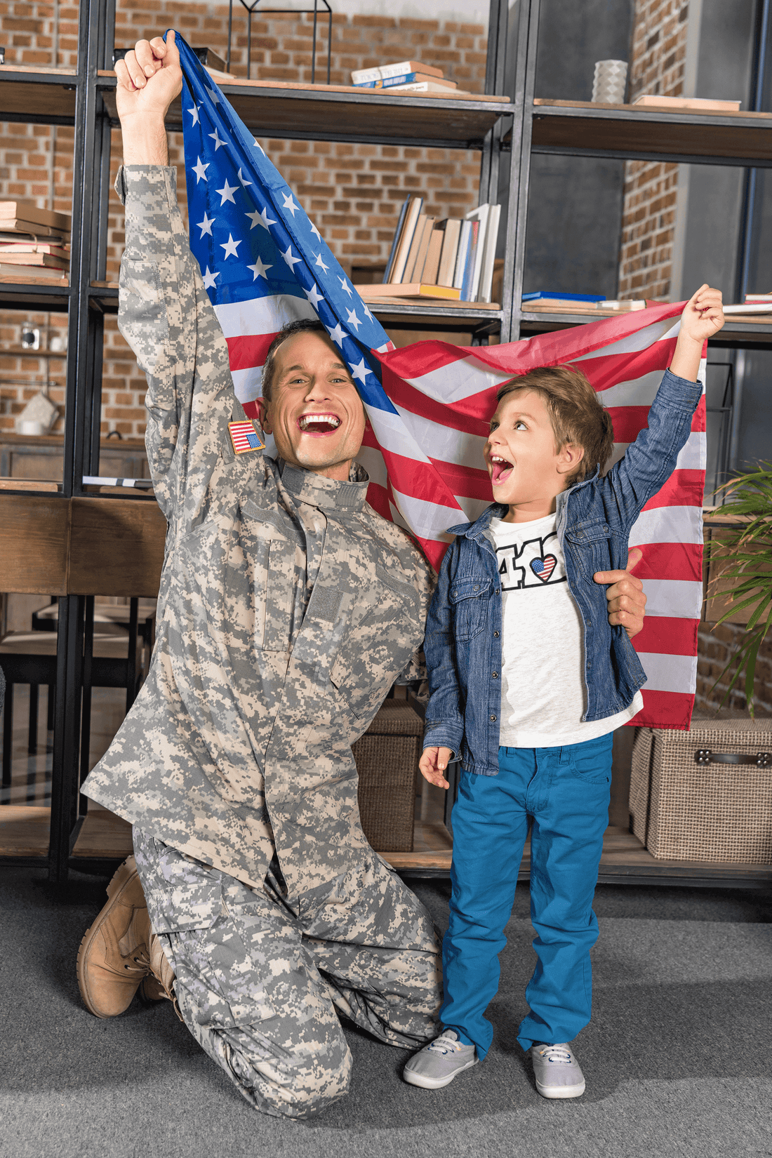 Remembering Together: A soldier and child joyfully holding an American flag in celebration.