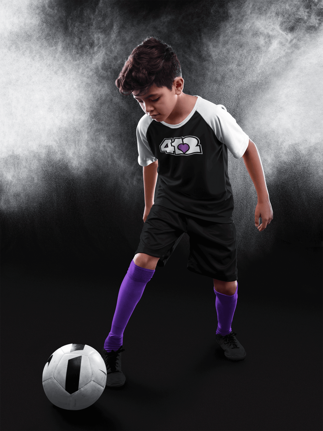 A young soccer player in action, showcasing our commitment to Investing in Community through sports engagement.