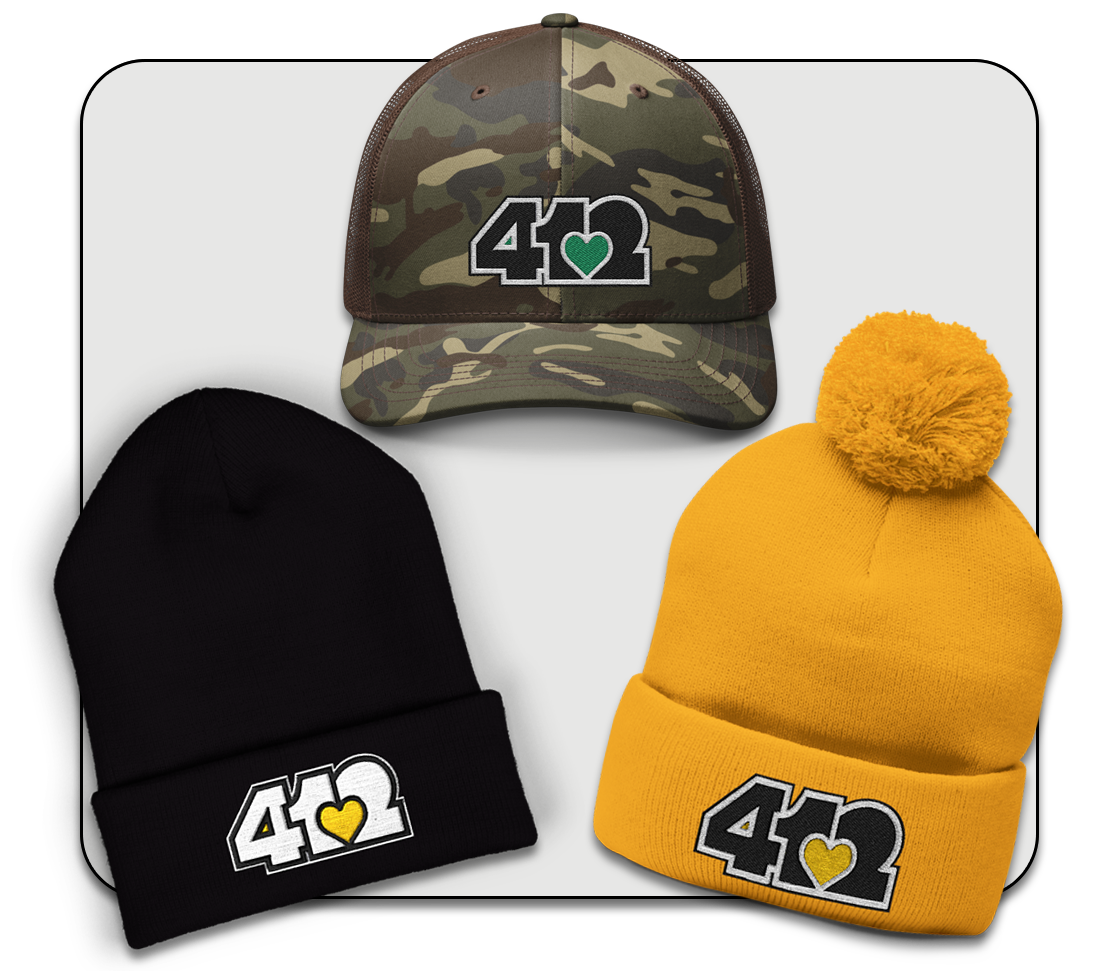 Stylish headwear options featuring a woman wearing a beanie with a pom-pom and a striped shirt in an urban setting.