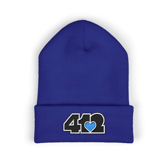 Cozy 412 Cuffed Beanie Hat | Embroidered Black and Blue Logo. Apparel Color: Royal. Featuring a snug cuffed fit, and soft acrylic for winter style.