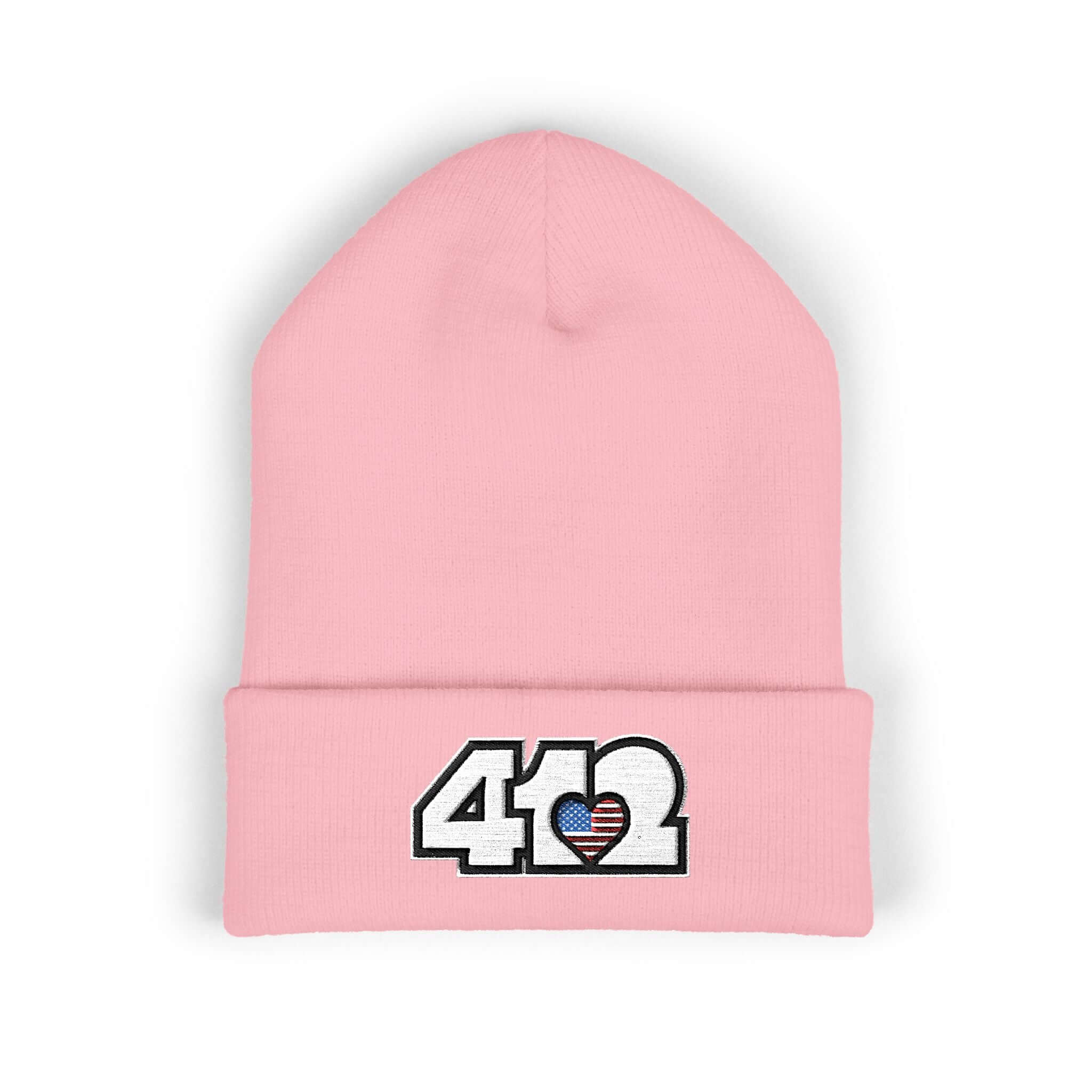 Cozy 412 Cuffed Beanie Hat | Embroidered Stars & Stripes White Logo. Apparel Color: Baby Pink. Featuring a snug cuffed fit, and soft acrylic for winter style.