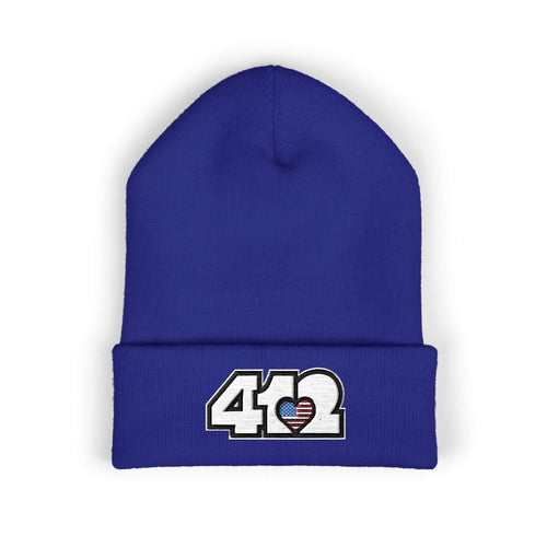 Cozy 412 Cuffed Beanie Hat | Embroidered Stars & Stripes White Logo. Apparel Color: Royal. Featuring a snug cuffed fit, and soft acrylic for winter style.