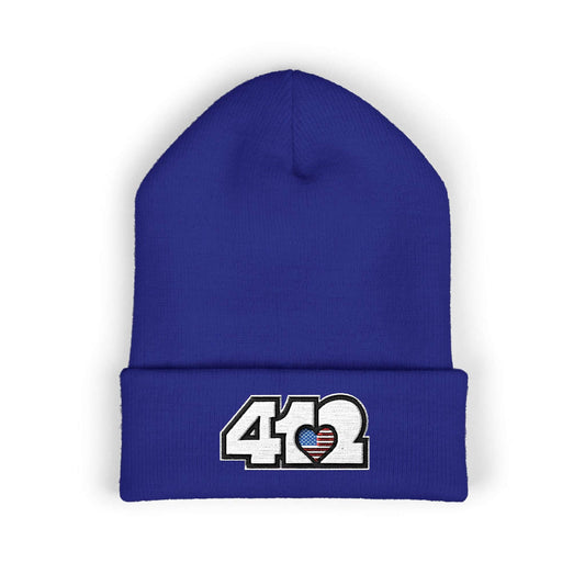 Cozy 412 Cuffed Beanie Hat | Embroidered Stars & Stripes White Logo. Apparel Color: Royal. Featuring a snug cuffed fit, and soft acrylic for winter style.