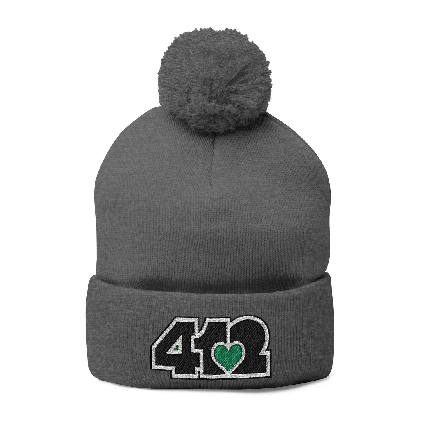 Cozy 412 Tossle Cap | Embroidered Black and Green Logo. Apparel Color: Dark Heather Grey. Has soft acrylic knit, fold-over cuff, and one-size fit for winter comfort.