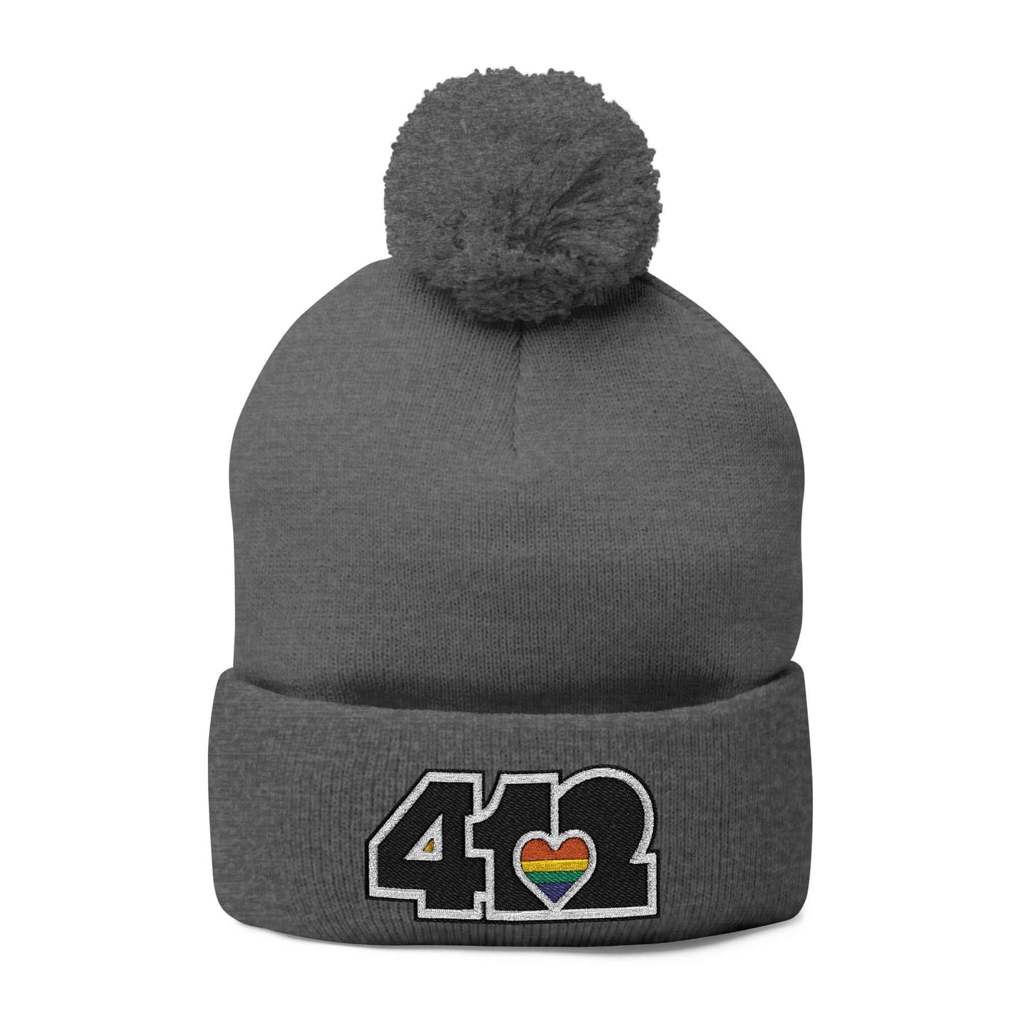 Cozy 412 Tossle Cap | Embroidered Black and Rainbow Logo. Apparel Color: Dark Heather Grey. Has soft acrylic knit, fold-over cuff, and one-size fit for winter comfort.