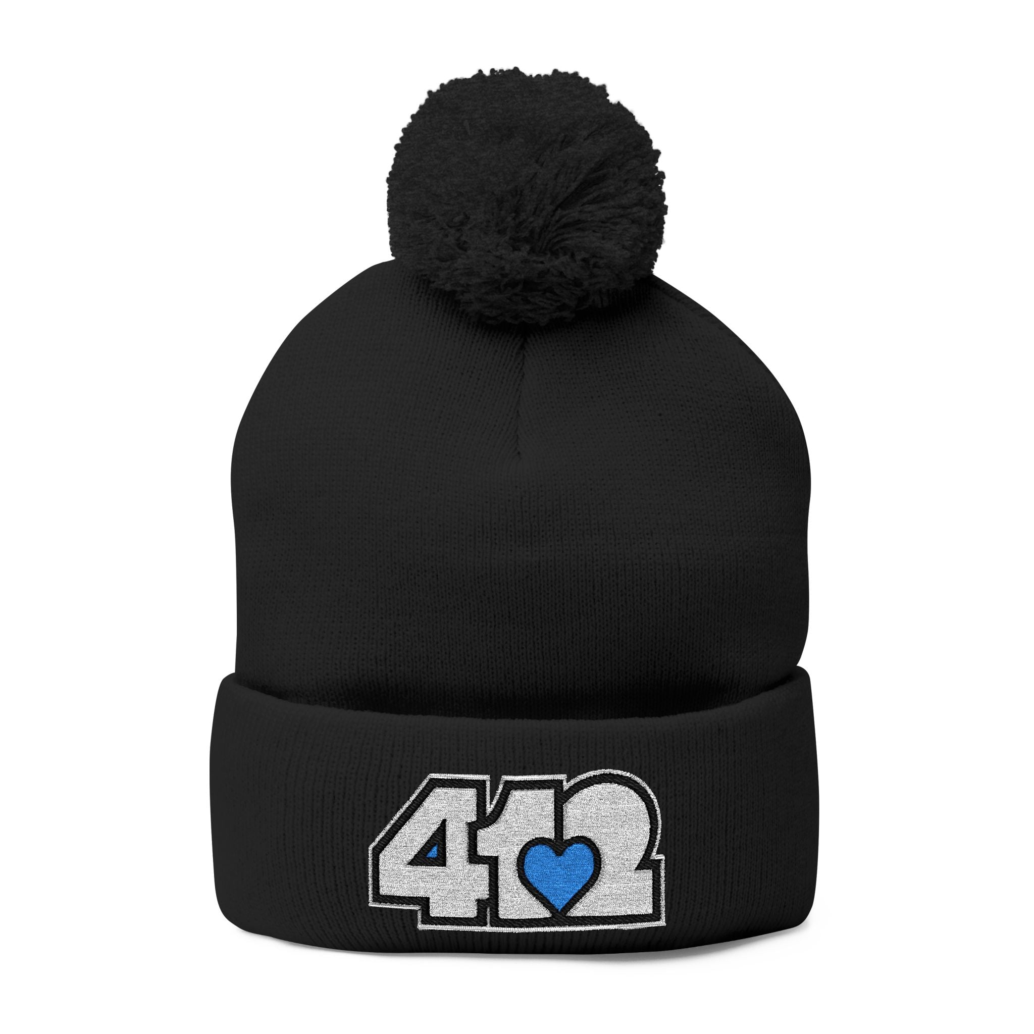 412 Tossle Cap | Embroidered White and Blue Logo. Apparel Color: Black. Has soft acrylic knit, fold-over cuff, and one-size fit for winter comfort.