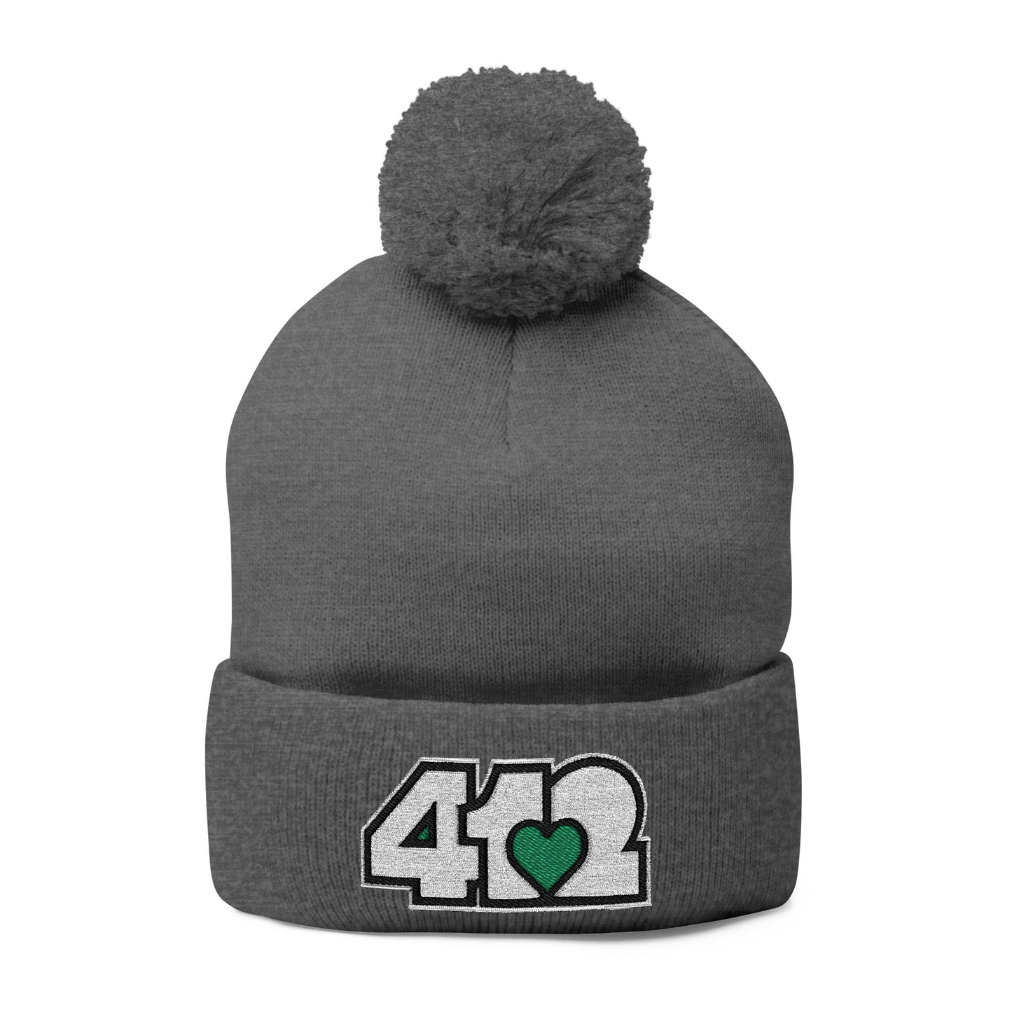 Cozy 412 Tossle Cap | Embroidered White and Green Logo. Apparel Color: Dark Heather Grey. Has soft acrylic knit, fold-over cuff, and one-size fit for winter comfort.