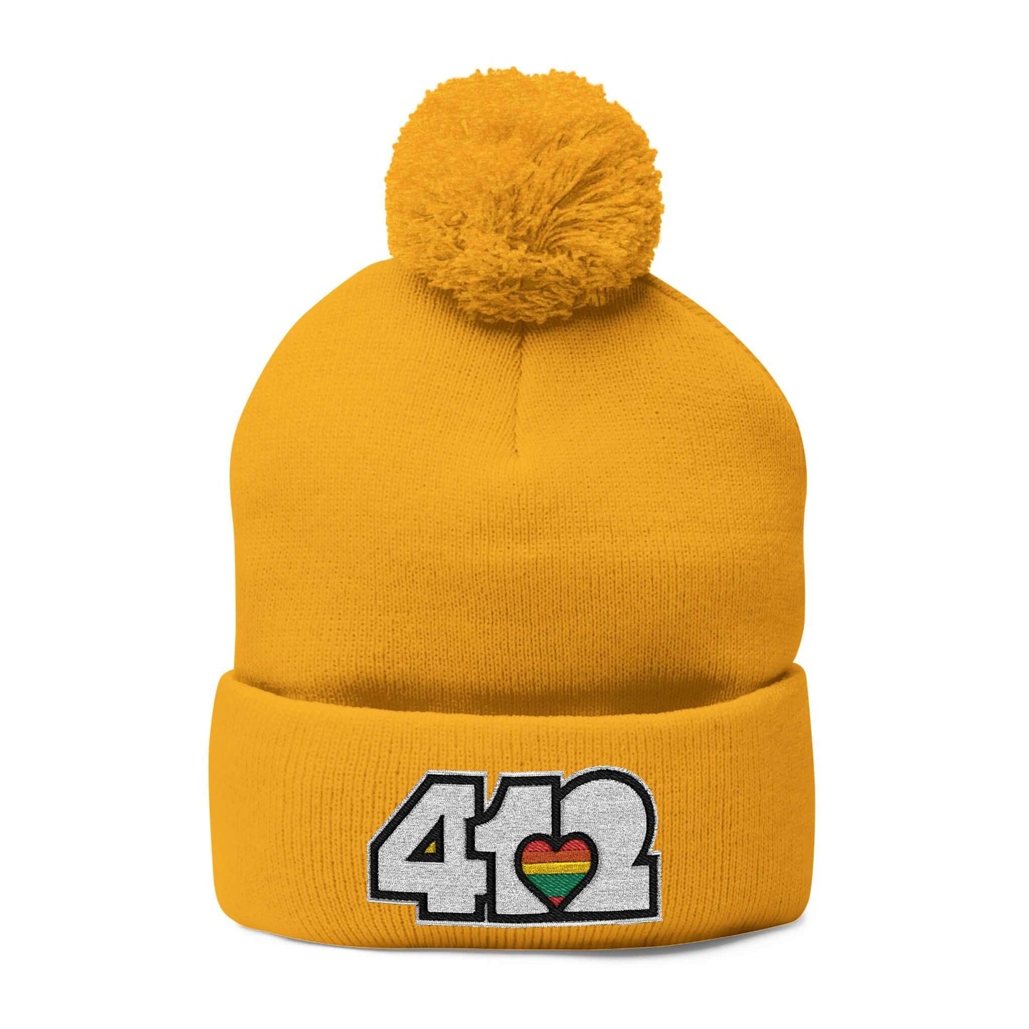 Cozy 412 Tossle Cap | Embroidered White and Rainbow Logo. Apparel Color: Gold. Has soft acrylic knit, fold-over cuff, and one-size fit for winter comfort.