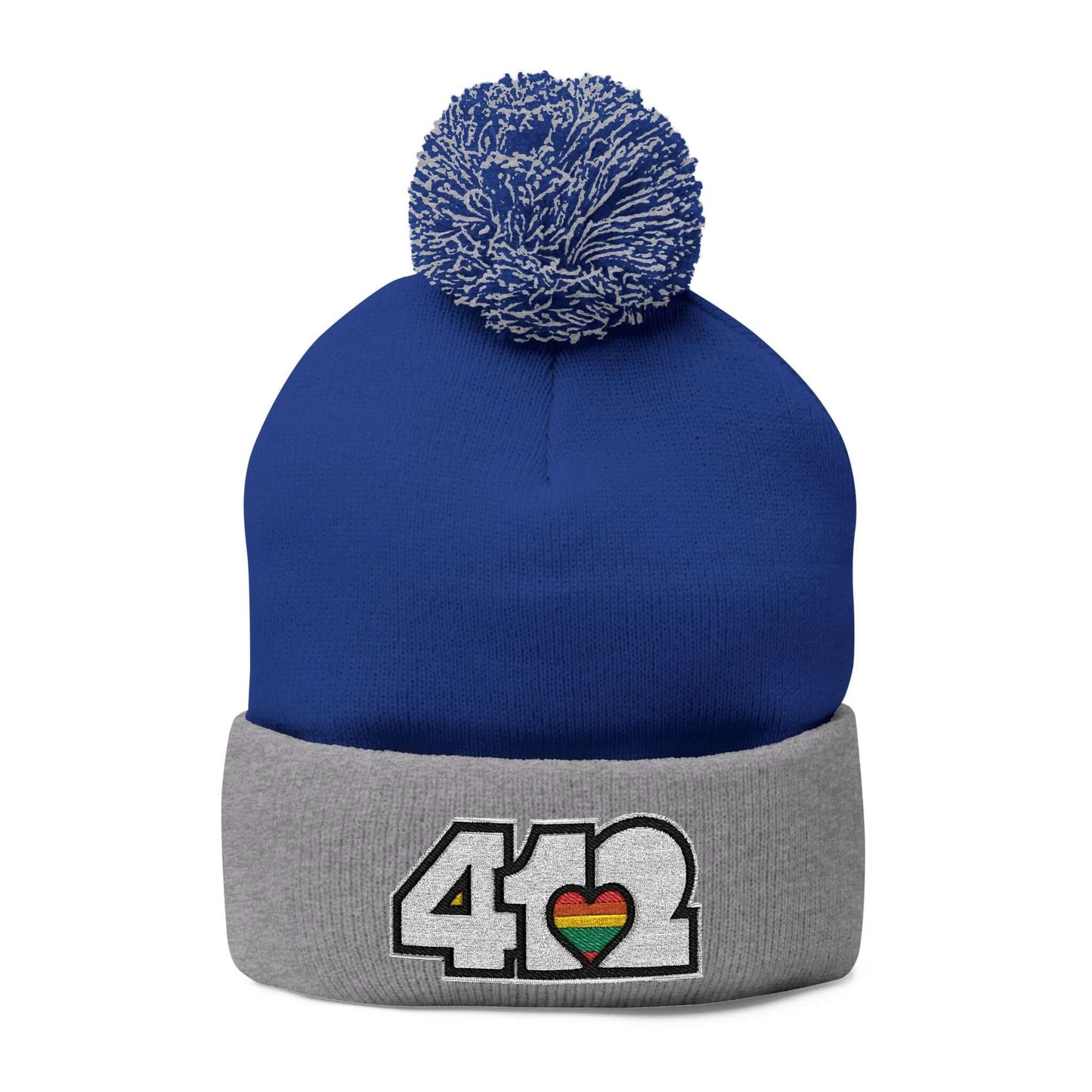 Cozy 412 Tossle Cap | Embroidered White and Rainbow Logo. Apparel Color: Royal / Heather Grey. Has soft acrylic knit, fold-over cuff, and one-size fit for winter comfort.