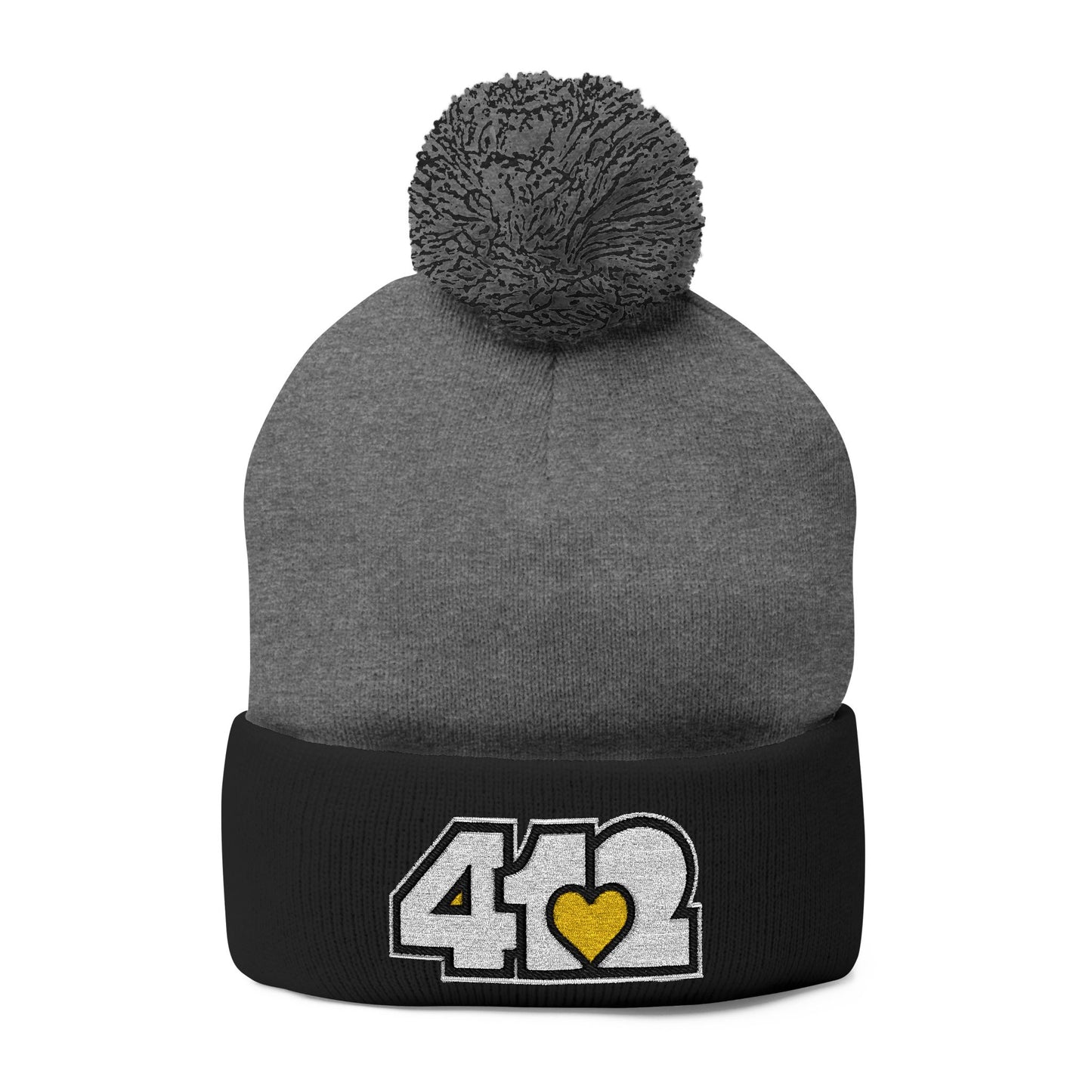 Cozy 412 Tossle Cap | Embroidered White and Yellow Logo. Apparel Color: Dark Heather Grey / Black. Has soft acrylic knit, fold-over cuff, and one-size fit for winter comfort.