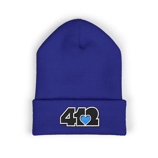 Royal Blue 412 Skull Crown beanie featuring black embroidered logo and blue heart patch — bold Pittsburgh streetwear with royal edge and cool-toned resilience.