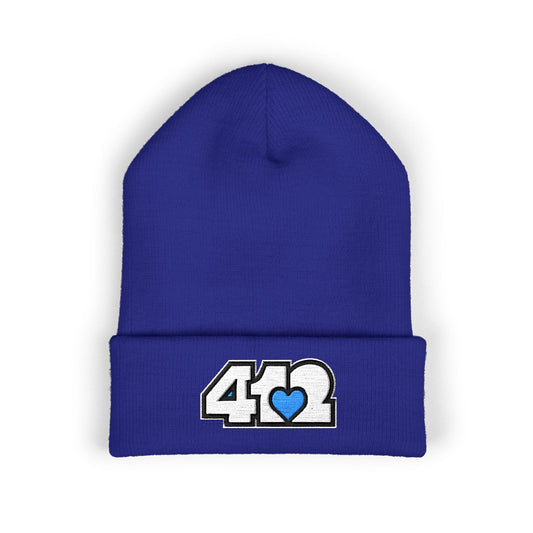 Royal Blue 412 Skull Crown beanie featuring white embroidered logo and blue heart patch — bold Pittsburgh streetwear with royal edge and cool-toned resilience.