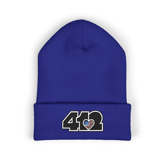 Royal Blue 412 Skull Crown beanie with Stars & Stripes embroidered heart and black logo, channeling Pittsburgh streetwear with regal edge and radiant contrast.