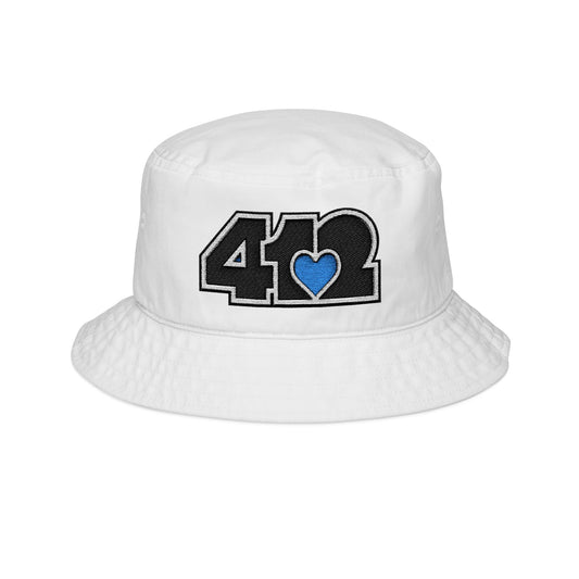 412 White Gilligan Crown bucket hat with embroidered blue heart and black 412 logo; sleek Pittsburgh streetwear with a cool, confident vibe.
