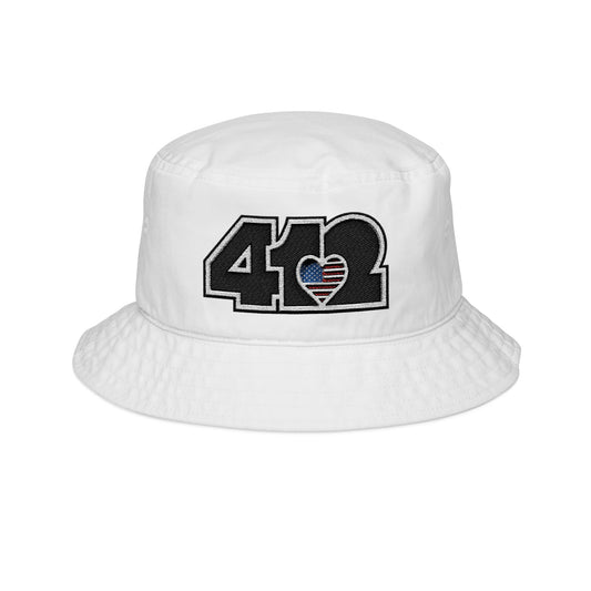 White 412 Gilligan Crown bucket hat with embroidered stars and stripes heart and black 412 logo; patriotic streetwear inspired by Pittsburgh culture.