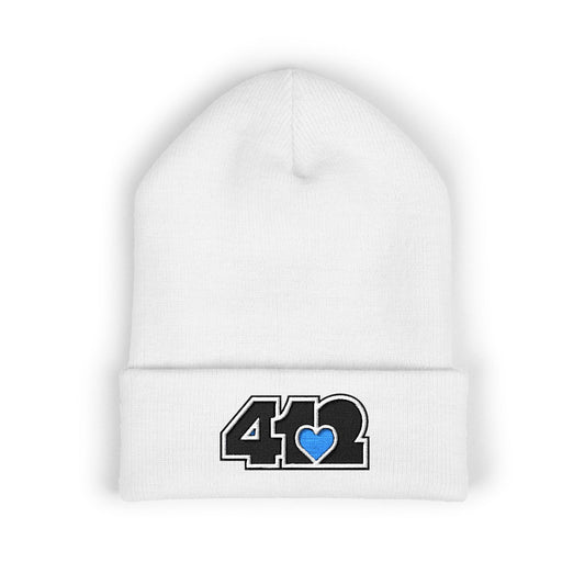 White 412 Skull Crown beanie featuring black embroidered logo and blue heart patch — bold Pittsburgh streetwear with royal edge and cool-toned resilience.