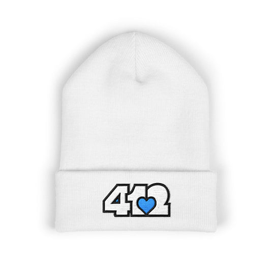 White 412 Skull Crown beanie featuring white embroidered logo and blue heart patch — bold Pittsburgh streetwear with royal edge and cool-toned resilience.