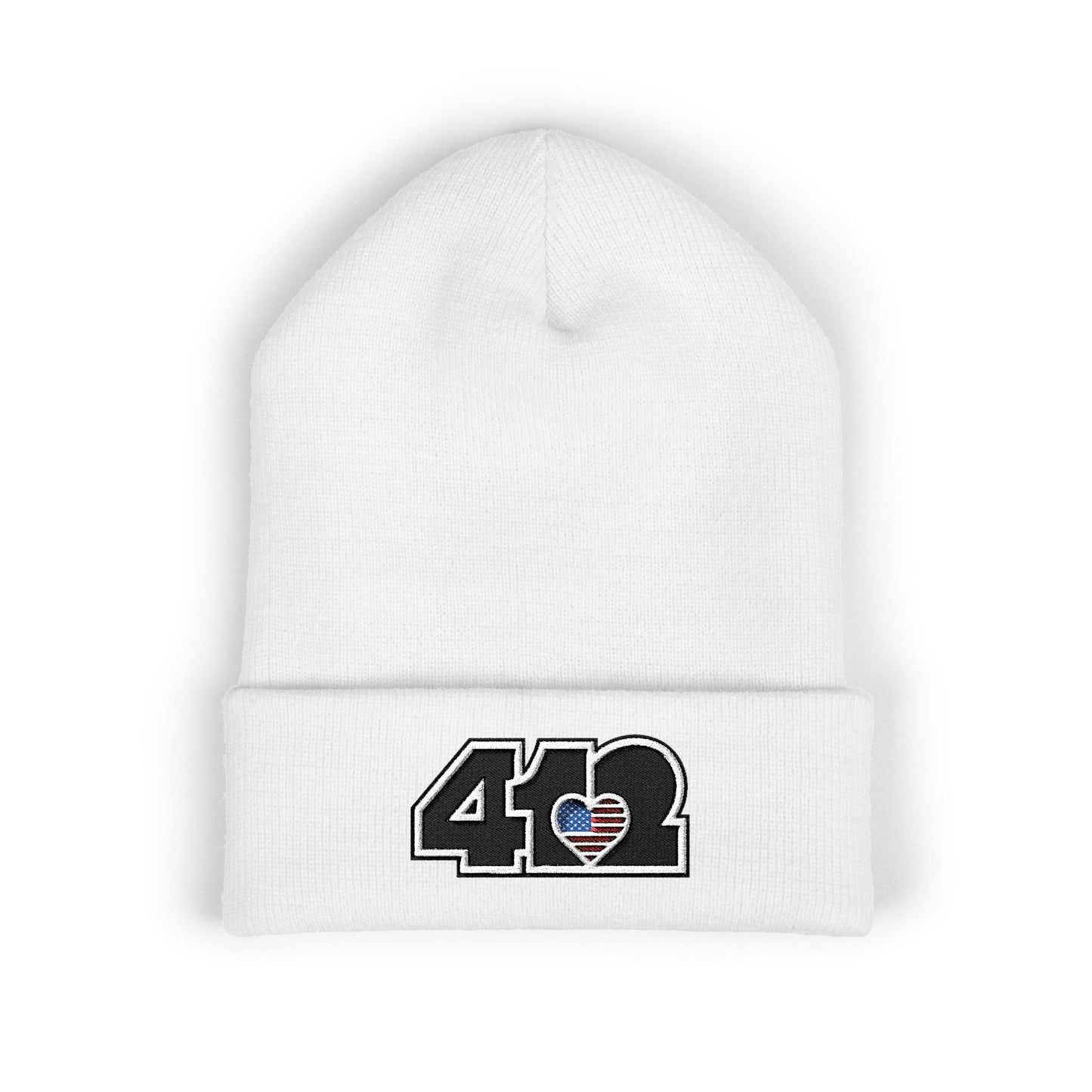 White 412 Skull Crown beanie with Stars & Stripes embroidered heart and black logo, channeling Pittsburgh streetwear with regal edge and radiant contrast.
