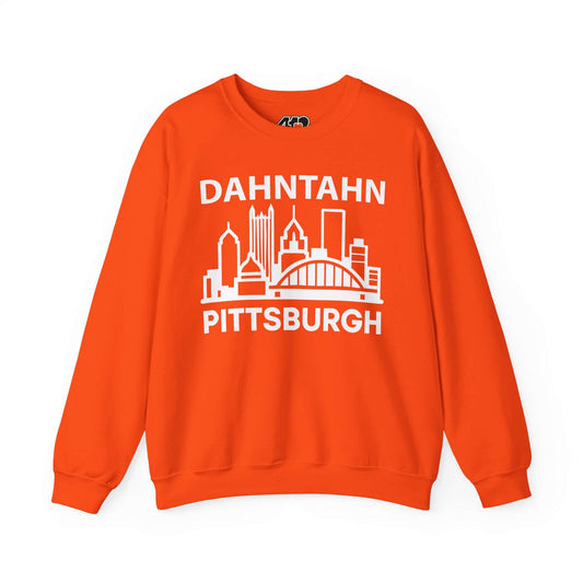 Dahntahn Pittsburgh Sweatshirt | White Logo. Apparel Color: Orange. A blend of 50% cotton and 50% polyester for cozy durability. With an Elastic ribbed collar, and Double-needle stitching.