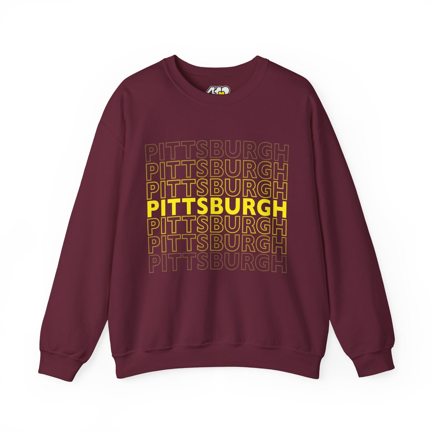 Pittsburgh Crewneck | On Repeat. Apparel Color: Maroon. A blend of 50% cotton and 50% polyester for cozy durability. With an Elastic ribbed collar, and Double-needle stitching.