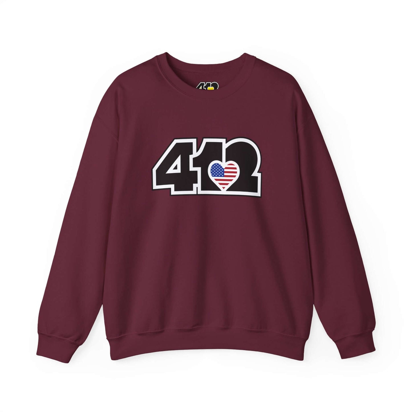 Pittsburgh Crewneck Sweatshirt | Black Stars & Stripes 412 Logo. Apparel Color: Maroon. A blend of 50% cotton and 50% polyester for cozy durability. With an Elastic ribbed collar, and Double-needle stitching.