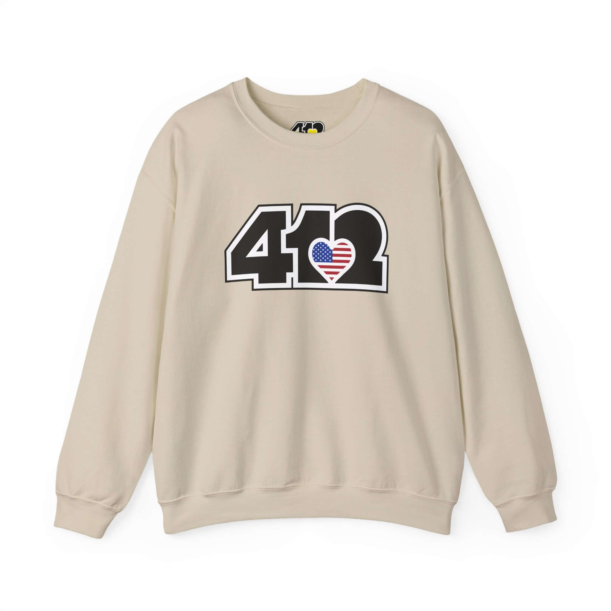 Pittsburgh Crewneck Sweatshirt | Black Stars & Stripes 412 Logo. Apparel Color: Sand. A blend of 50% cotton and 50% polyester for cozy durability. With an Elastic ribbed collar, and Double-needle stitching.