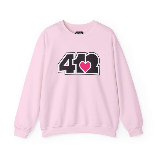 Pittsburgh Crewneck Sweatshirt | Black and Pink 412 Logo. Apparel Color: Light Pink. A blend of 50% cotton and 50% polyester for cozy durability. With an Elastic ribbed collar, and Double-needle stitching.
