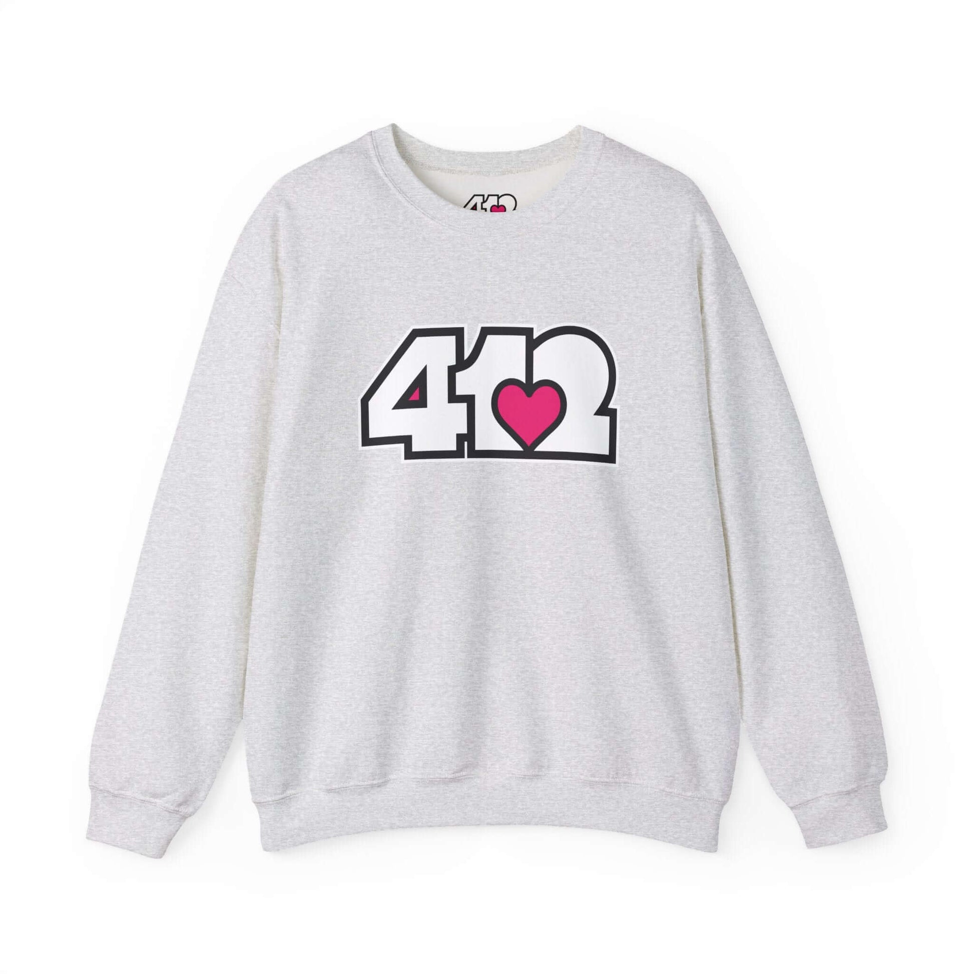 Pittsburgh Crewneck Sweatshirt | White and Pink 412 Logo. Apparel Color: Ash. A blend of 50% cotton and 50% polyester for cozy durability. With an Elastic ribbed collar, and Double-needle stitching.