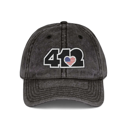Pittsburgh Vintage Hat | Embroidered Black Stars and Stripes 412 Logo. Apparel Color: Black. A relaxed fit, cotton twill fabric, adjustable buckle, and washed-out finish look.