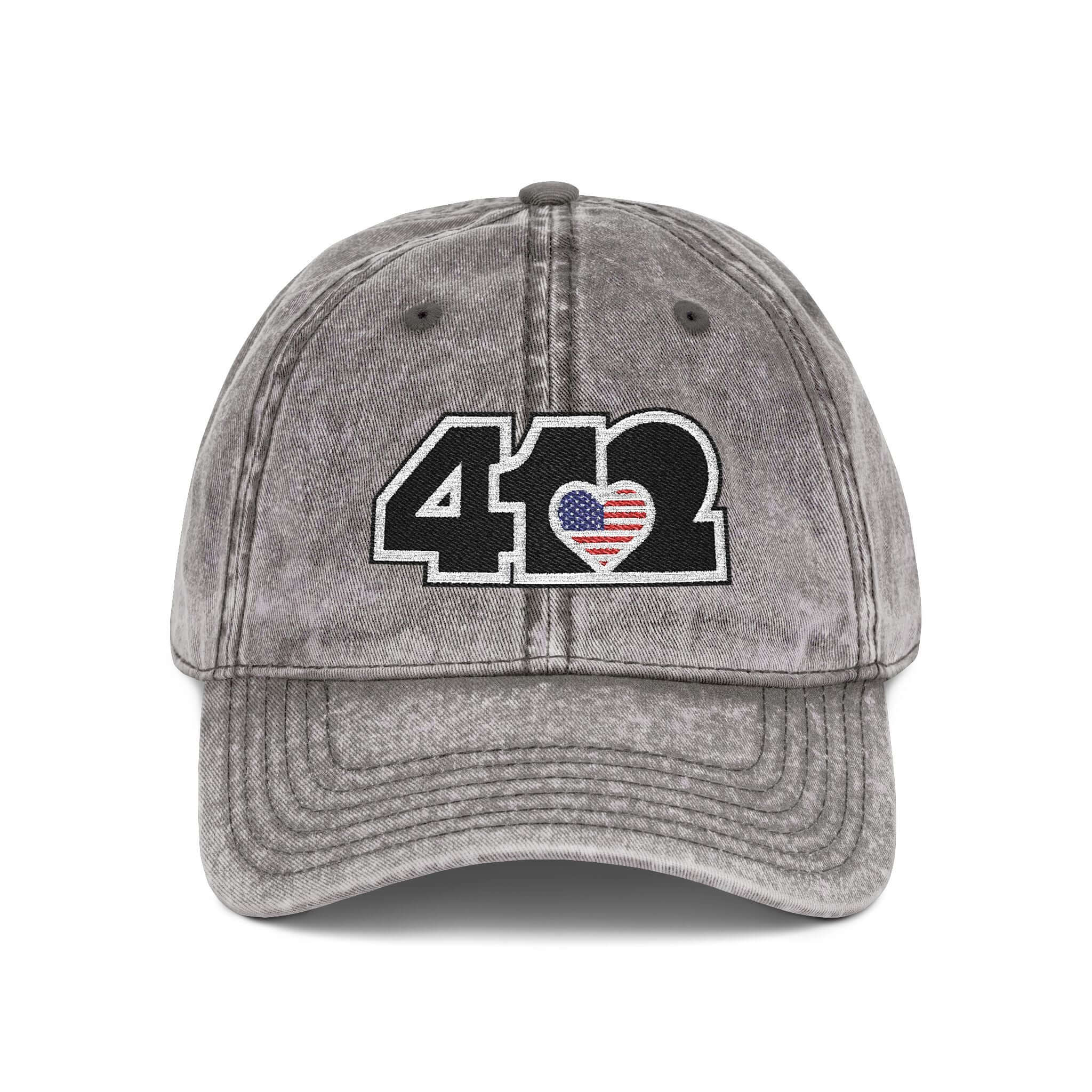 Pittsburgh Vintage Hat | Embroidered Black Stars and Stripes 412 Logo. Apparel Color: Charcoal Grey. A relaxed fit, cotton twill fabric, adjustable buckle, and washed-out finish look.