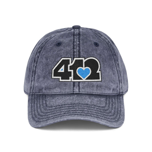 Pittsburgh Vintage Hat | Embroidered Black and Blue 412 Logo. Apparel Color: Navy. A relaxed fit, cotton twill fabric, adjustable buckle, and washed-out finish look.
