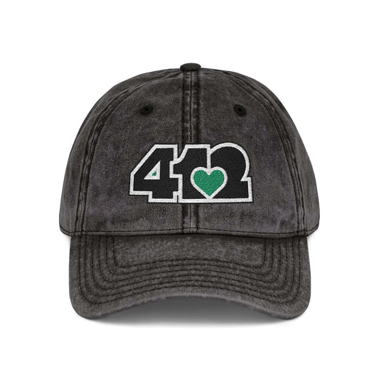 Pittsburgh Vintage Hat | Embroidered Black and Green 412 Logo. Apparel Color: Black. A relaxed fit, cotton twill fabric, adjustable buckle, and washed-out finish look.