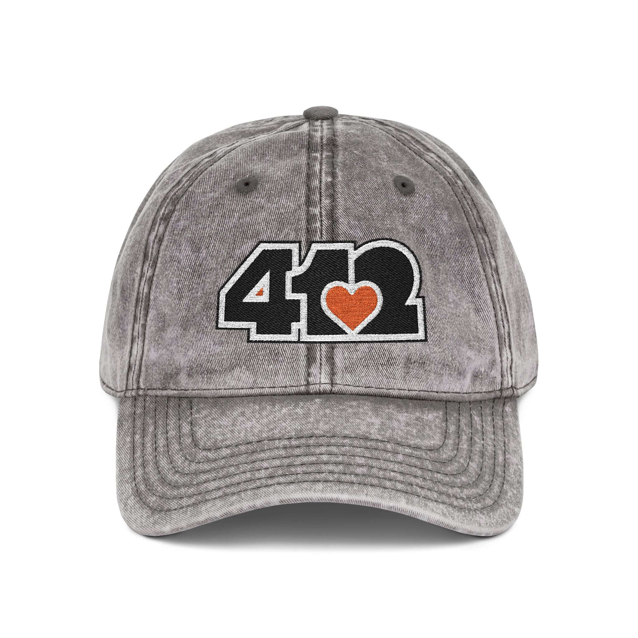 Pittsburgh Vintage Hat | Embroidered Black and Orange 412 Logo. Apparel Color: Charcoal Grey. A relaxed fit, cotton twill fabric, adjustable buckle, and washed-out finish look.
