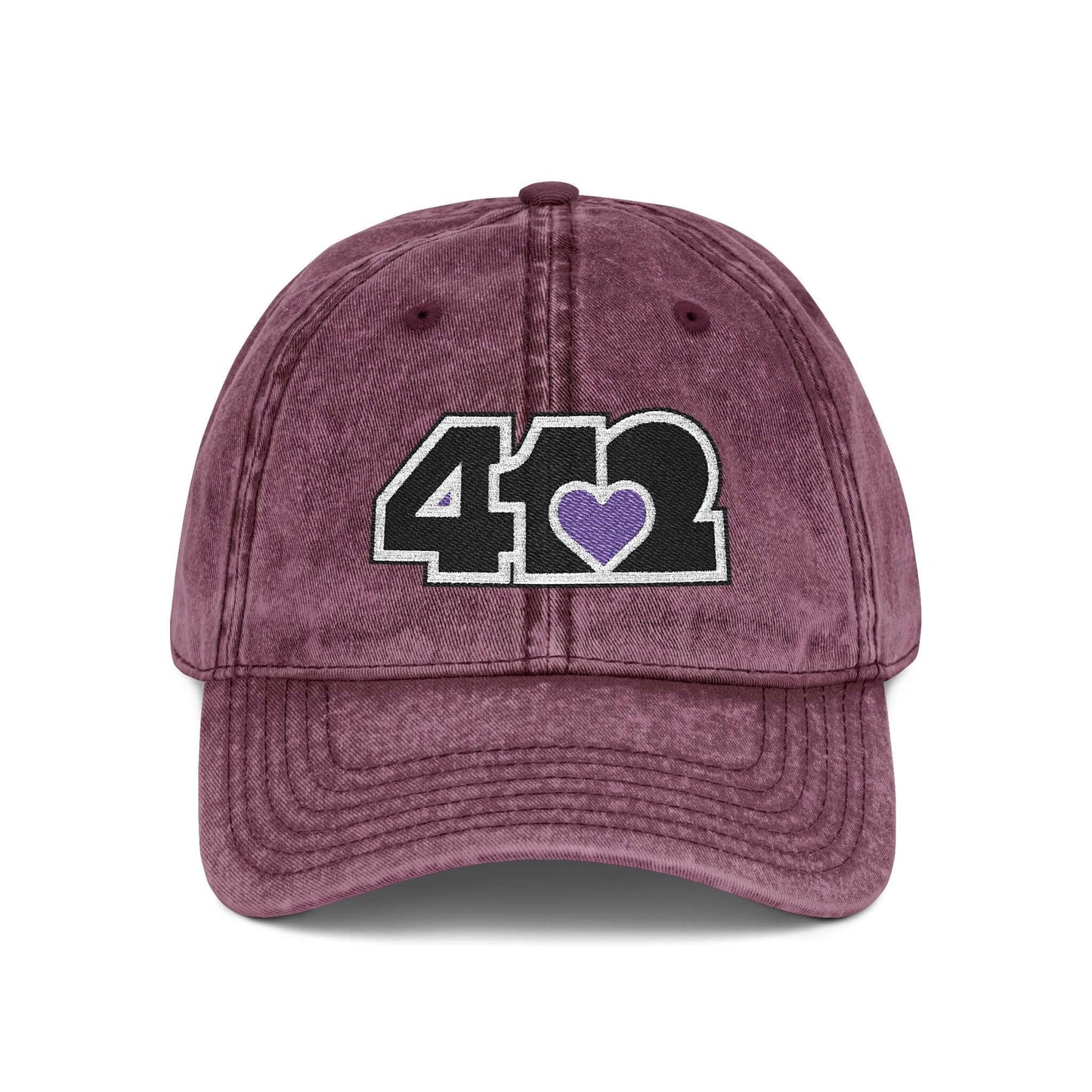 Pittsburgh Vintage Hat | Embroidered Black and Purple 412 Logo. Apparel Color: Maroon. A relaxed fit, cotton twill fabric, adjustable buckle, and washed-out finish look.