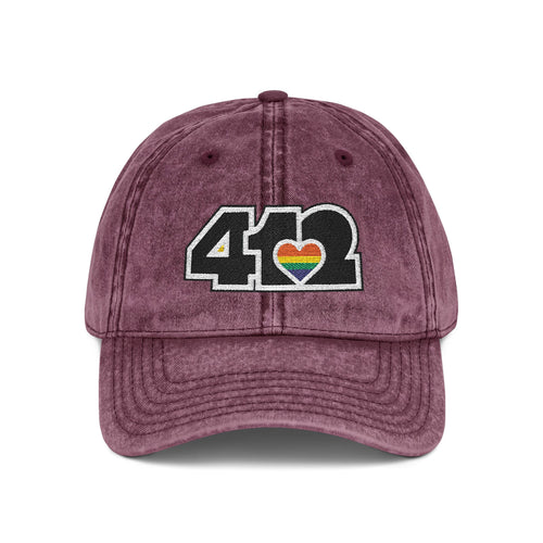 Pittsburgh Vintage Hat | Embroidered Black and Rainbow 412 Logo. Apparel Color: Maroon. A relaxed fit, cotton twill fabric, adjustable buckle, and washed-out finish look.