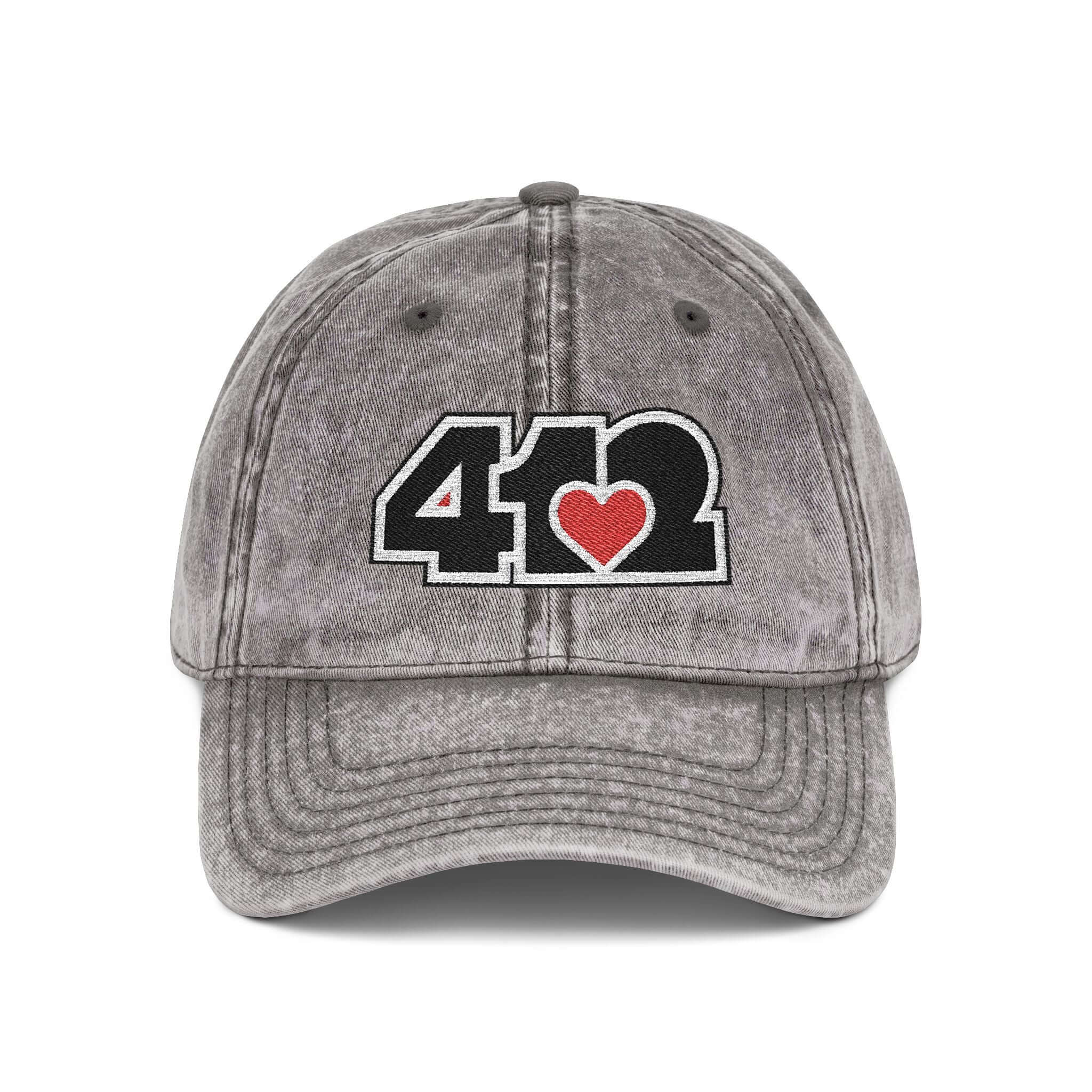 Pittsburgh Vintage Hat | Embroidered Black and Red 412 Logo. Apparel Color: Charcoal Grey. A relaxed fit, cotton twill fabric, adjustable buckle, and washed-out finish look.