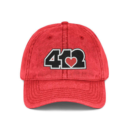 Pittsburgh Vintage Hat | Embroidered Black and Red 412 Logo. Apparel Color: Red. A relaxed fit, cotton twill fabric, adjustable buckle, and washed-out finish look.