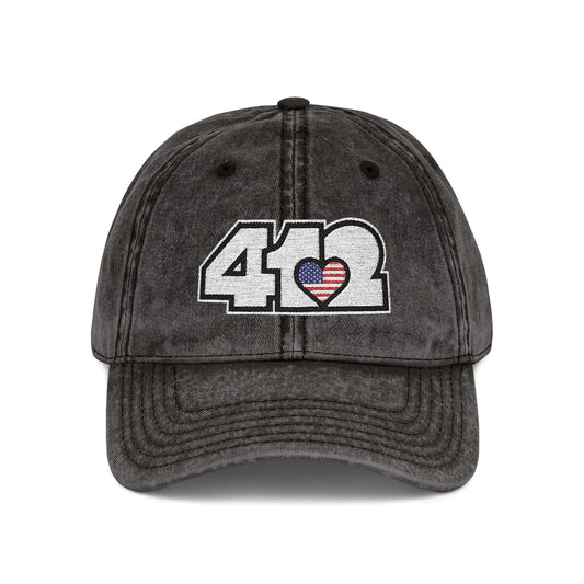 Pittsburgh Vintage Hat | Embroidered White Stars and Stripes 412 Logo. Apparel Color: Black. A relaxed fit, cotton twill fabric, adjustable buckle, and washed-out finish look.