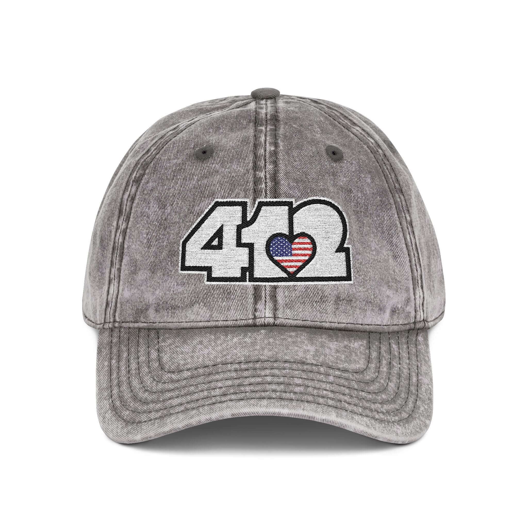 Pittsburgh Vintage Hat | Embroidered White Stars and Stripes 412 Logo. Apparel Color: Charcoal Grey. A relaxed fit, cotton twill fabric, adjustable buckle, and washed-out finish look.