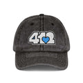 Pittsburgh Vintage Hat | Embroidered White and Blue 412 Logo. Apparel Color: Black. A relaxed fit, cotton twill fabric, adjustable buckle, and washed-out finish look.