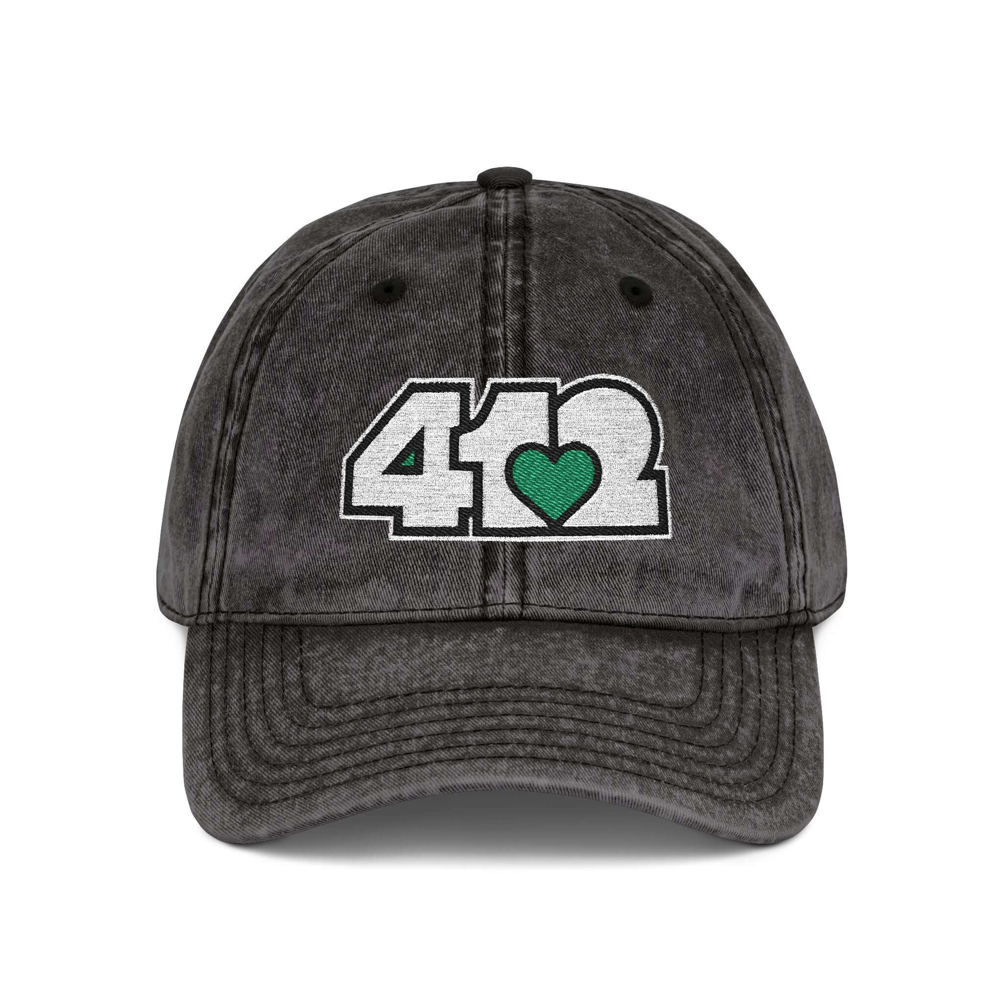 Pittsburgh Vintage Hat | Embroidered White and Green 412 Logo. Apparel Color: Black. A relaxed fit, cotton twill fabric, adjustable buckle, and washed-out finish look.